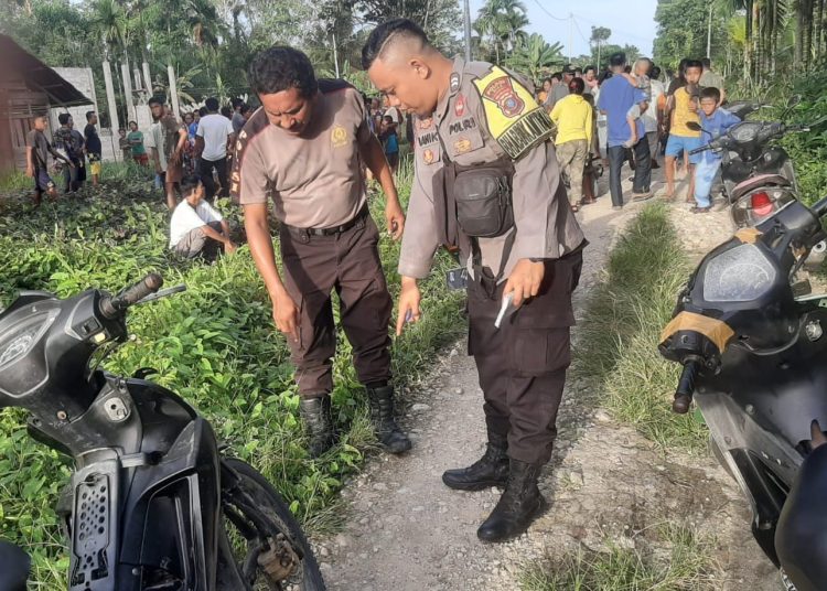 Personel Polsek Bawolato, Polres Nias melakukan olah TKP  di Desa Sisarahili, Kecamatan Bawolato, Kabupaten Nias.(Satunusantara news/HO-Istimewa).