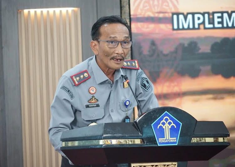 Kakanwil Kemenkum Sumut, Ignatius Mangantar Tua Silalahi, saat  menyampaikan laporan.(Satunusantara news/HO-Kanwil Kemenkum Sumut)